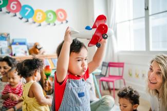 child playing in classroom 