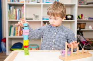 child playing with blocks 